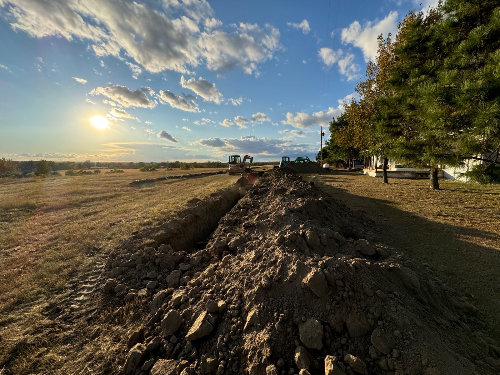 Septic system drainfield fabric runs excavation