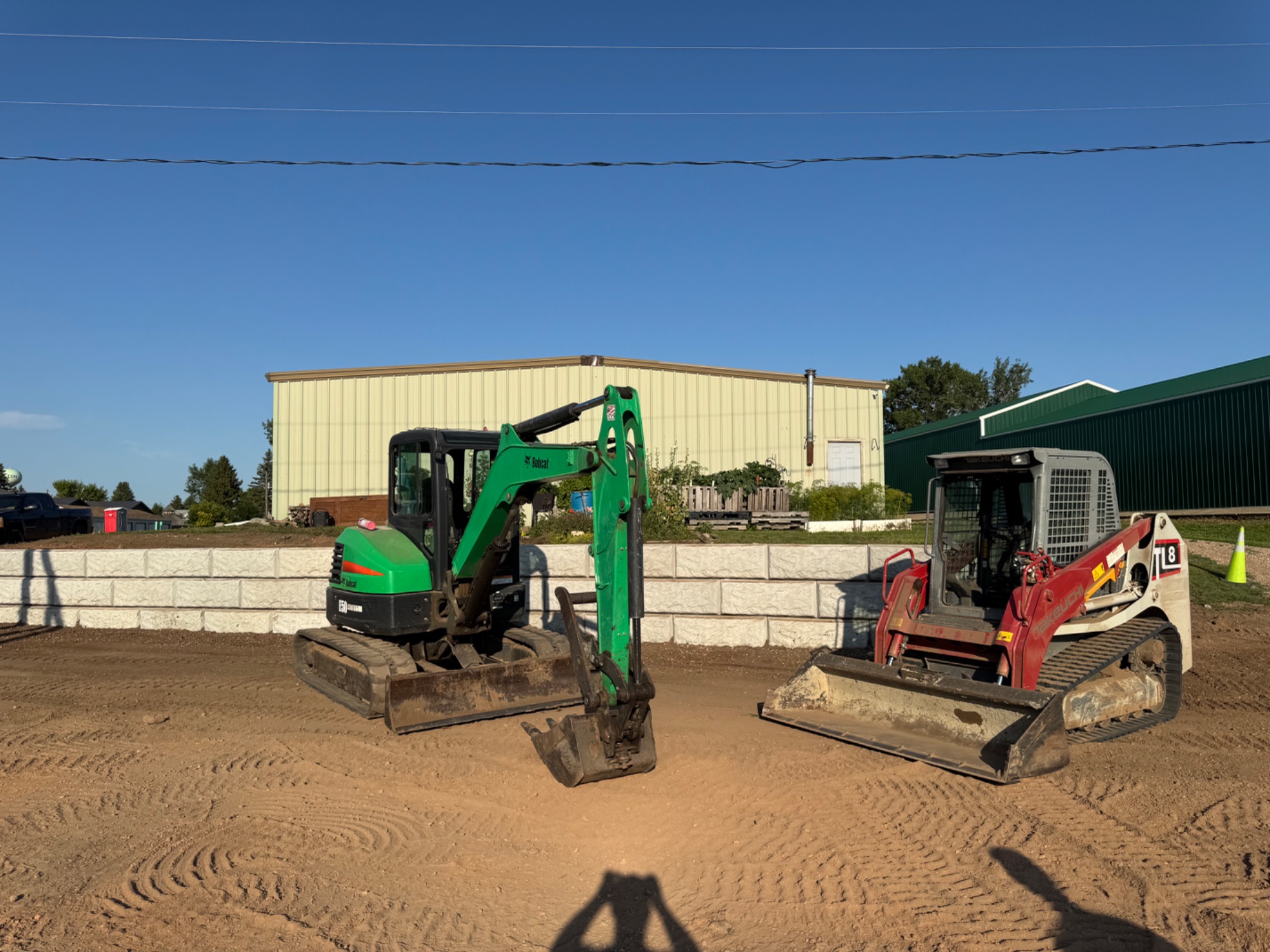 Dakota Earthworks excavation equipment at Wilton retaining wall project